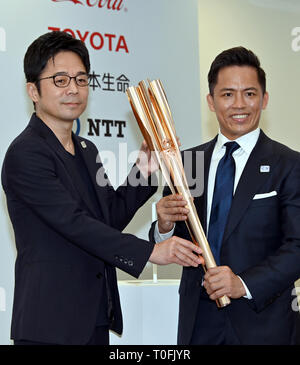 Tokyo, Japan. 20th Mar, 2019. Tadahiro Nomura, three-time Olympic judo champion, shows the Olympic torch in Tokyo on Wednesday, March 20, 2019. The torch, bearing the motif of a cherry blossom, Japans national flower, will be used during the Tokyo 2020 Olympic torch relay.  (Photo by Natsuki Sakai/AFLO) AYF -mis- Credit: Aflo Co. Ltd./Alamy Live News Stock Photo