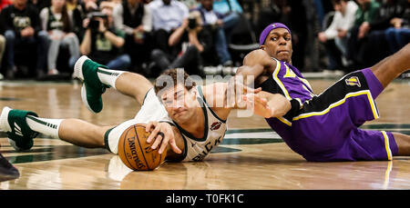 Beijing, USA. 19th Mar, 2019. XINHUA SPORTS PHOTO OF THE DAY (March 20, 2019) TRANSMITTED ON March 20, 2019. Milwaukee Bucks' Brook Lopez (L) and Los Angeles Lakers' Rajon Rondo vie for the ball during the NBA regular season basketball game between Los Angeles Lakers and Milwaukee Bucks in Milwaukee, Wisconsin, the United States, on March 19, 2019. Credit: Joel Lerner/Xinhua/Alamy Live News Stock Photo