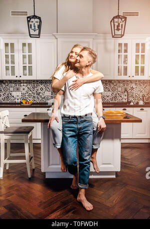 Lovely couple are hugging and smiling while spending time together Stock Photo