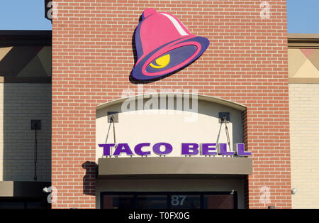 Exterior Taco Bell fast food chain building with logo sign in New Bedford, Massachusetts USA on sunshine blue sky day Stock Photo