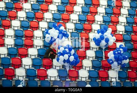 TEL AVIV, ISRAEL. March 17, 2015. Woman fixing blue and white balloons in the hall of the Tel Aviv Convention Center during the Zionist Camp party Stock Photo