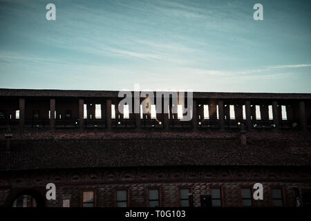 Sunset and sunlights behind the big brick wall Stock Photo