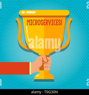 Word writing text Microservices. Business photo showcasing Software development technique Decomposing an application Hand Holding Blank Golden Champio Stock Photo