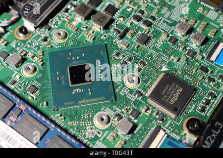 Closeup view at laptop motherboard and components. Processor or CPU as its brain. Stock Photo