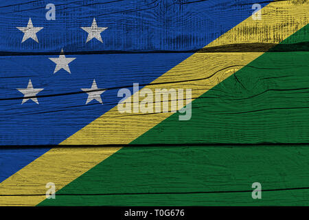 Solomon Islands flag painted on old wood plank. Patriotic background. National flag of Solomon Islands Stock Photo