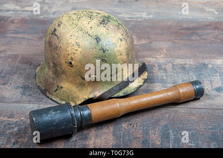 German World War Two (Stahlhelm) military helmets with a grenade Stock Photo