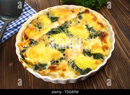 Salmon - Fish Gratin with Spinach Stock Photo