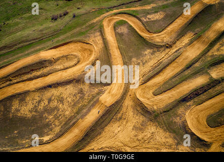 Aerial view of racing motocross bikes in racetrack. Outdoor motor sport from drone view. - Image Stock Photo