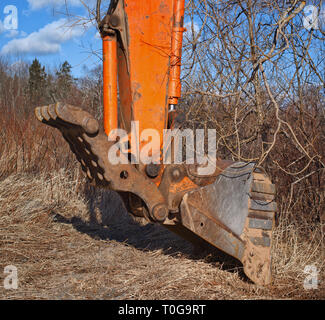 Excavator bucket detail on a sunny day. Stock Photo