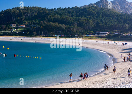 Playa de Rodas, picturesque crescent of fine white sand, turquoise water backed by dunes & pine trees, Cíes Islands, Ria de Vigo, Spain Stock Photo