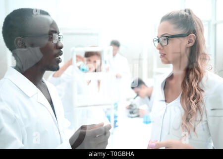 multinational scientists work in a modern laboratory Stock Photo