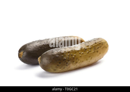 Two pickled cucumbers isolated on white background. Salting concept. Copy space Stock Photo