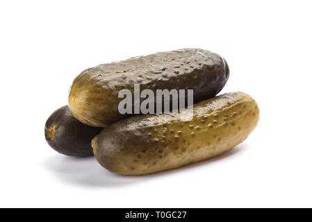 Three pickled cucumbers isolated on white background. Salting concept. Copy space Stock Photo