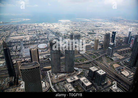 View of buildings from 124 th floor of Burj Khalifa, tallest building structure in the world, Dubai, UAE. Stock Photo