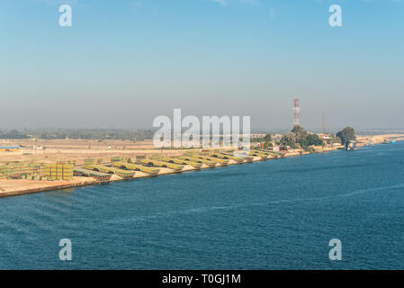 El Qantara, Egypt - November 5, 2017: Pontoons bridge for crossing the Suez Canal lie on the shore of canal near El Qantara, Egypt. Stock Photo