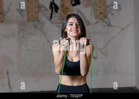 Girl jumping rope in the gym Stock Photo