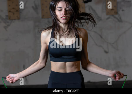 Girl jumping rope in the gym Stock Photo