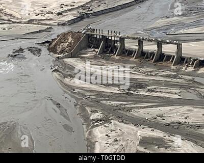 Aerial view showing the destroyed Spencer Dam after a massive ice jam destroyed the hydroelectric dam on the Niobrara River in Boyd County March 16, 2019 near Spencer, Nebraska. Historic flooding caused by rapid melting of record snowfall sweep through rural communities in Nebraska and Iowa killing at least four people in the Plains and Midwest. Stock Photo