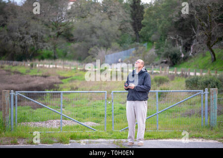 Man flying drone with remote control Stock Photo