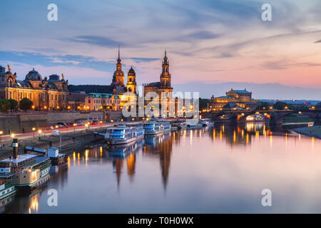 Incredible evening panorama of Cathedral of the Holy Trinity or Hofkirche, Bruehl's Terrace or The Balcony of Europe. Dramatic autumn sunset on Elbe r Stock Photo