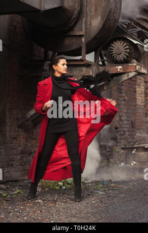 Woman in a red raincoat steampunk Stock Photo