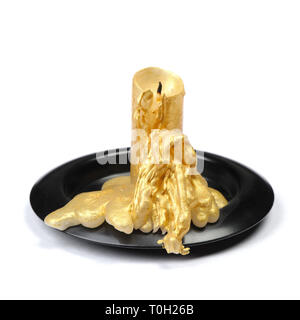 Old golden wax candle on a black stand isolated over white background Stock Photo