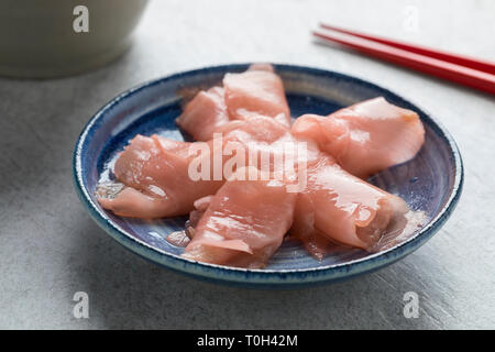 Pink pickled sushi ginger slices in bowl Stock Photo