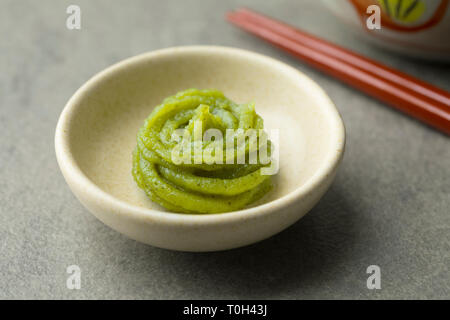 Bowl with traditional Japanese horseradish paste close up Stock Photo