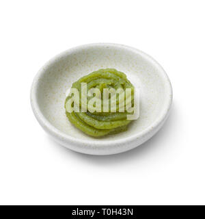 Bowl with traditional Japanese horseradish paste isolated on white background Stock Photo