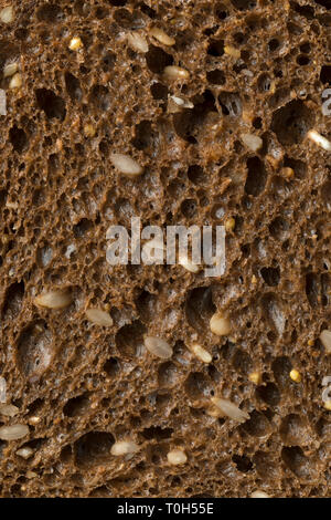 Slice of brown healthy multi grain bread full frame close up Stock Photo