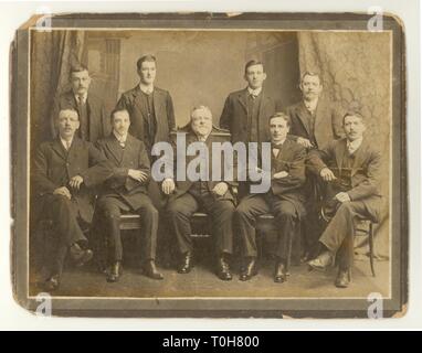 Original Edwardian era formal studio photograph portrait of male staff working at Threlfalls Brewery, boss seated in middle, probably Liverpool, U.K. , dated 1910 Stock Photo