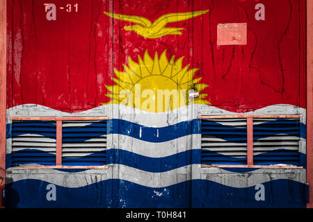 Close-up of old warehouse gate with national flag of Kiribati. Concept of Kiribati export-import, storage of goods and national delivery of goods. Fla Stock Photo