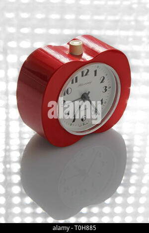 Vintage alarm clock apple inspired, isolated on white background, close-up Stock Photo
