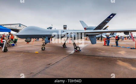 General Atomics MQ-9 Reaper drone flying over the mountains at sunset ...