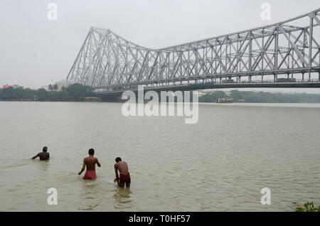 Men bathing in hooghly river, Kolkata, West Bengal, India, Asia Stock Photo