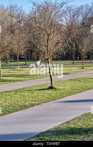 March 2019 milan italy old senior man practicing fitness sport at the north park (parco nord) in a sunny day - healthcare activity Stock Photo