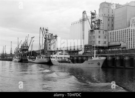 Early 1970s photo of ships moored against Spillers flour mill wharf in Newcastle upon Tyne, England, UK Stock Photo