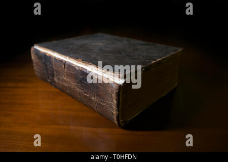 Old Book on Desk Stock Photo