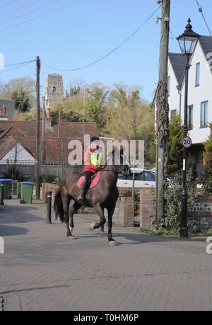 lady riding her horse in the small sussex village of bramber west sussex Stock Photo