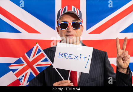 British male businessman with Brexit banner and UK flag Stock Photo