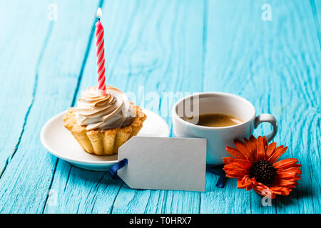 Gerbera, postcard, coffee and cake Stock Photo