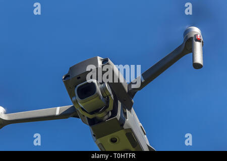 drone flying overhead against blue sky Stock Photo
