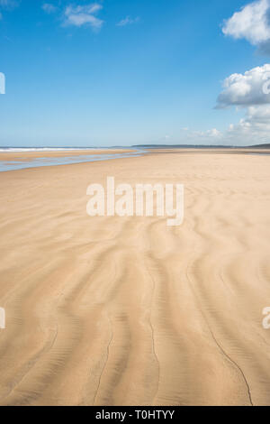 Ripples in the sand caused by the tidal movement of the sea on Holkham bay beach, North Norfolk coast, East Anglia, England, UK. Stock Photo