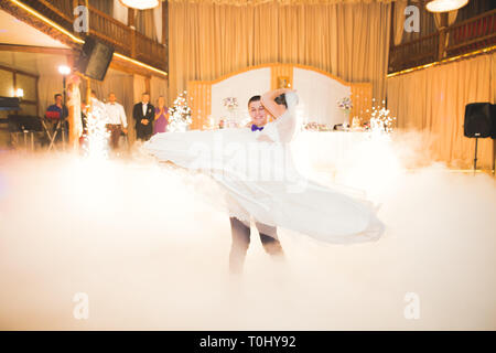 First wedding dance of newlywed couple in restaurant. Stock Photo