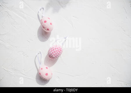 Top view of easter eggs colored with pink paint in differen patterns. Various striped and dotted designs. White background. Copy space.Egg design Stock Photo