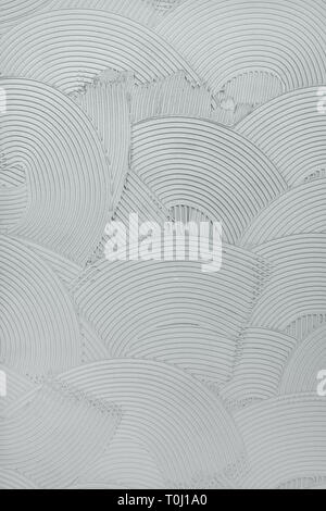 Decorative plaster wall finish texture, modern urban wavy overlapping concentric circle pattern background Stock Photo