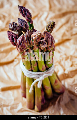 Tips of fresh raw asparagus ready to be cooked Stock Photo