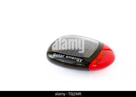 Solar bicycle tail light, isolated on white background. Eco friendly / green energy cycle concept. Stock Photo