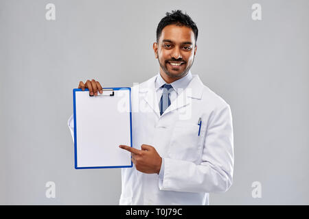 doctor or scientist with white paper on clipboard Stock Photo