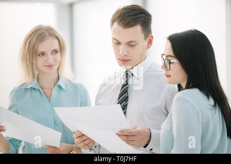 close up. Manager and employees discussing business documents Stock Photo